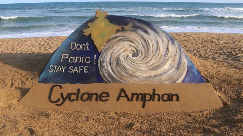 Sand art on beach telling people to stay calm during super-cyclone Amphan
